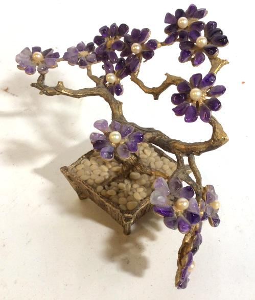 Vintage miniature metal and stone tree figural: Miniature jeweled tree, possibly amethyst natural gemstones, Figural measuring approximately 4.5 inches in height. Width is approximately 6.5 inches. Figural is majority metal with purple stones and w
