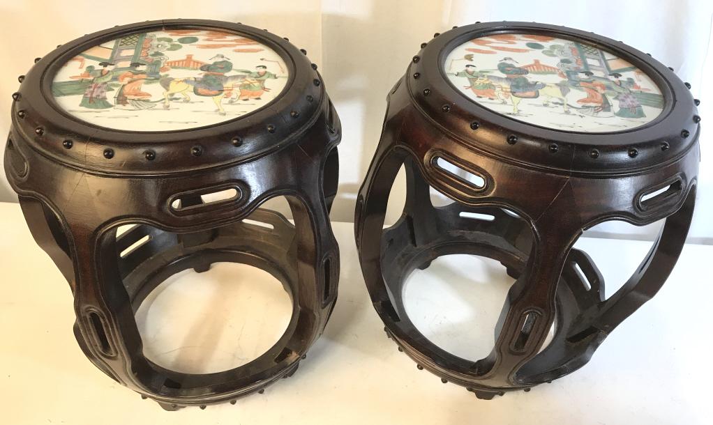 Vintage Carved Wooden Chinese Stools: Stools are vintage Possibly antique. Stools have carved wooden detail. Tops of stools appear to be porcelain and are possibly hand painted. Both stools have 5 wooden feet. Pieces measure approx 17.5 i