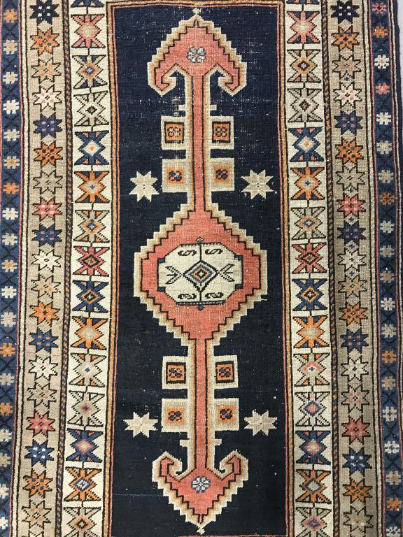 Handmade Geometrically Detailed Antique Wool Rug: Rug is vintage possibly antique. Rug contains Geometrically detailed with tones of navy, sand, black & orange. Piece measures approx 70 inches long 40 inches wide. home accent and decor, decorative ar