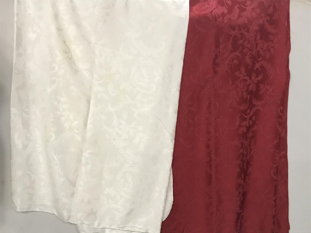 Lot 2 Holiday Tablecloths, Red, White: Red tablecloth design with holly and berries. Measures 114 x 69 in. approx. Recently dry cleaned. No noticeable marks. White tablecloth, matching image, same fabric, same size. Recently dry cleaned, b