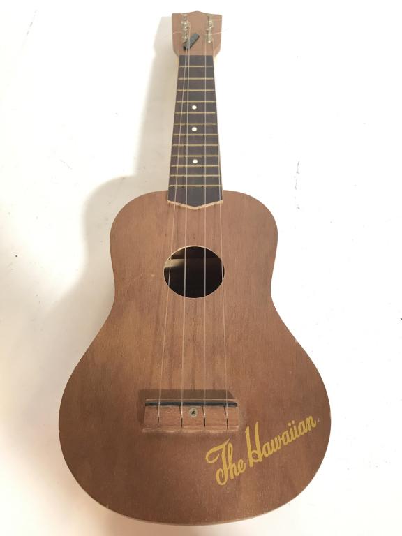 THE HAWAIIAN Ukelele Decorative Accessory: Piece is marked THE HAWAIIAN. Measures approx 20 inches long 7 inches wide 3 inches deep. Might need restringing. wall hanging, decorative accessory, home accent and decor, decorative musical instrume