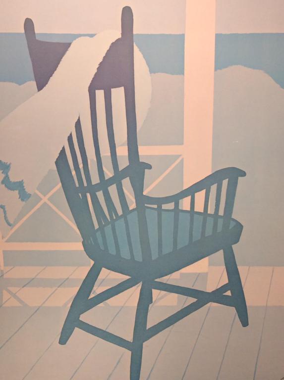 Framed Schoolhouse Gallery Poster Print: Poster depicts stylized Chair On deck overlooking water. Poster is set behind glass in in blue tone coated wood frame. Measures approx 37.5 inches in height by 25.5 inches in width with frame. Some st