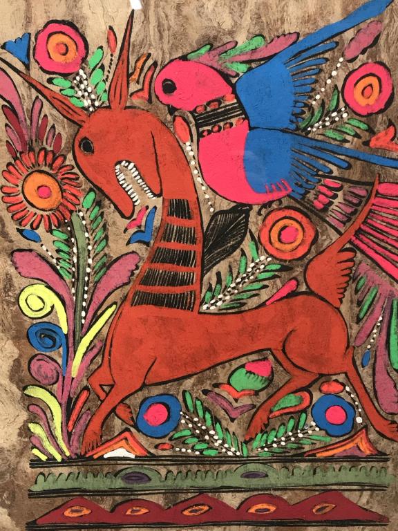 Petrykivka Ukrainian Folk Art Style Painting: Painting on paper depicts deer and bird in brightly colored composition. Paper is set behind glass in wood frame. Measures approx 14.75 inches in height by 11.75 inches in width with frame. Decorative