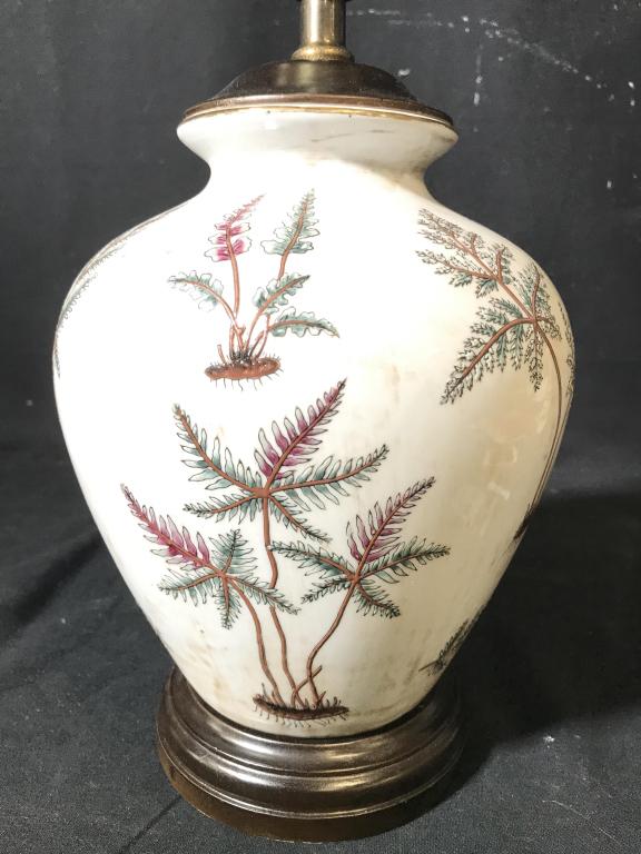 Painted Porcelain Table Lamp: Piece is porcelain and white toned with purple and green toned leaf detail. Measures approx 22 inches tall 7 inches wide. table lamp, home accent and accessories, home lighting, 6