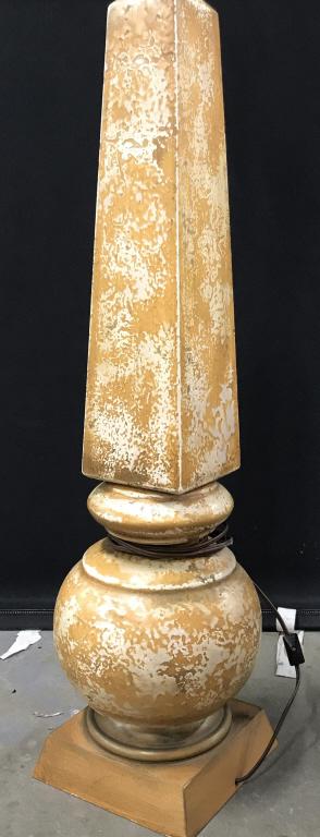 Textured Arts & Crafts Ceramic Floor Lamp: Decorated in a abstract textured Pattern, orange Color, Bottom is gourd like, rounded and majority of body is an obelisk. Twist switch at light and also a radial switch on cord. Measures 11 x 6 in. La