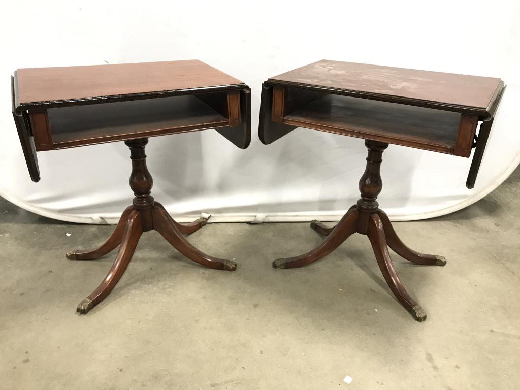 Pair Vintage Drop Leaf Wooden Side Tables: Lot includes 2 side tables. Each have carved wooden detail. Both pieces have drop leafs. Pieces have space underneath tabletops. Each measures approx 25 inches tall 15 inches deep 36 inches long. tabl