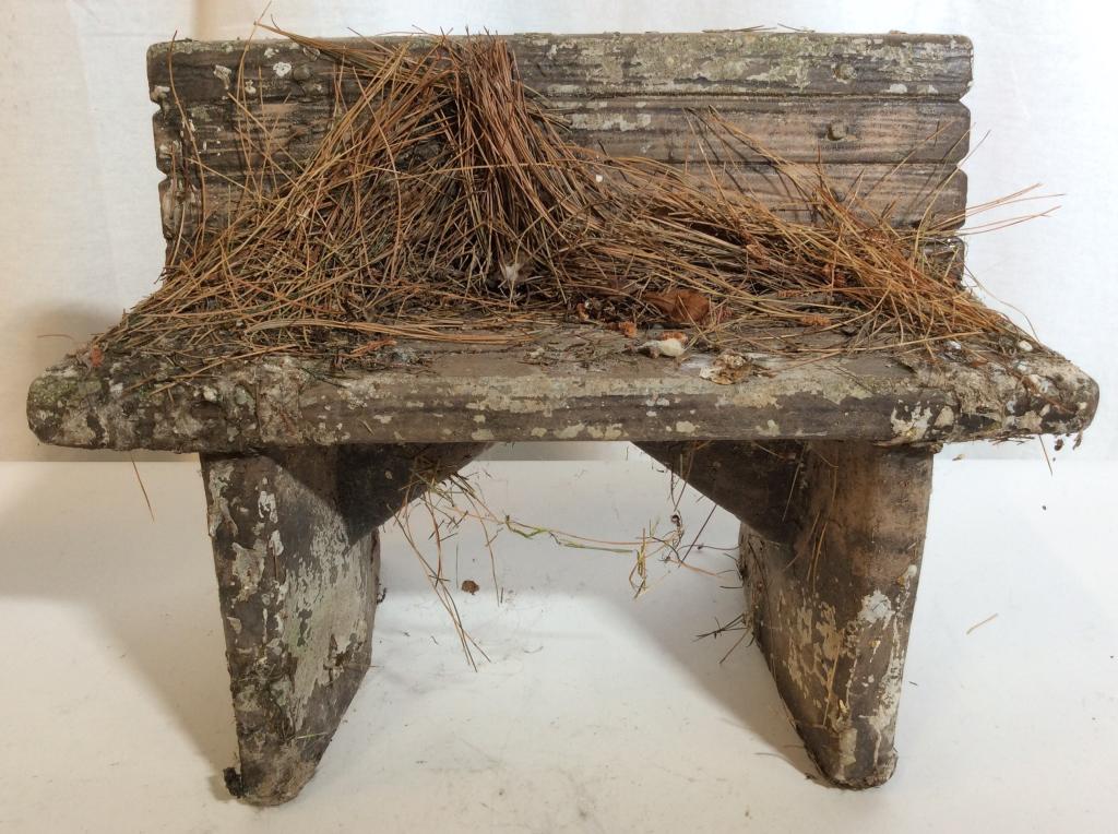 Miniature Cement Ceramic Bench: Miniature bench has a dark grey brown tone. Piece measures approx 12 inches long 9 inches tall 6 inches deep. Contains evident wear and weathering. garden statuary, home accent and decor 6.