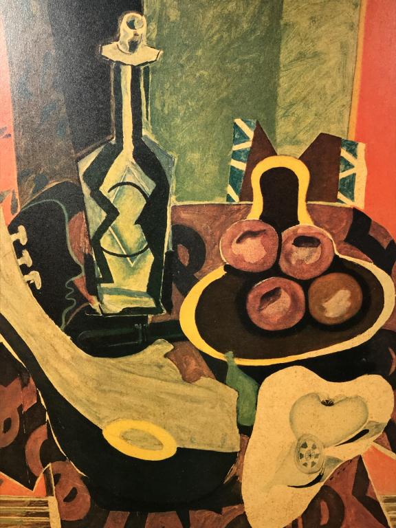 Framed Georges Braque Print On Board: Print depicts Georges Braque’s Red Pedestal. Board is lined and set in gold tone wood frame. Measures approx 39.75 inches in height by 21.5 inches in width with frame. Multiple blemishes in linen li