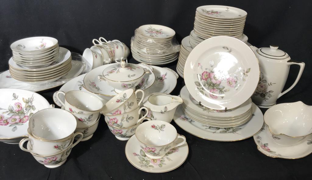 88-Pc SC Japan Rosa Fine China Dinner Service: Marked on underside for SC Japan. Rosa Design with white tone background, pink floral motifs, and gold tone trims. Coffee pot has music box on underside. Lot includes 12 dinner plates, 11 starter plat