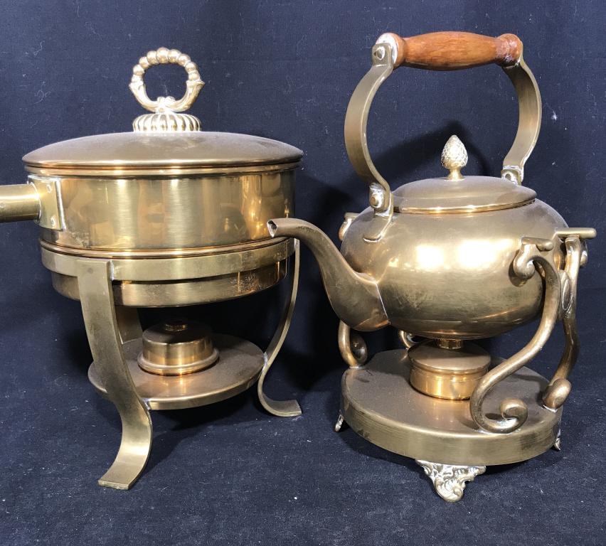 Lot 4 Brass Tnd & Wood Tea Kettle & Pot W Stands: Lot includes brass Tnd Metal tea kettle, pot, and two corresponding stands with burners. Pot and kettle have wood handles. Interior of pot is silver toned. Larger item, the pot stand, measures approxi