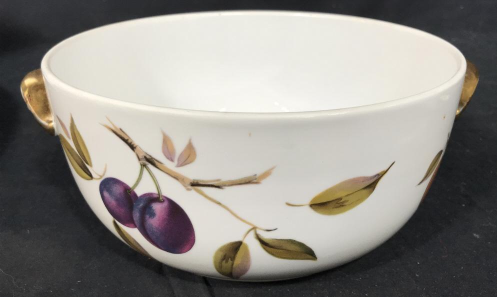 Royal Worcester EVESHAM Porcelain Serving Bowl: Marked on underside for Royal Worcester, English Porcelain, Fireproof. In EVESHAM style with plum fruit motifs against white background with gold tone handles. Measures approx 4 inches in height by 8.