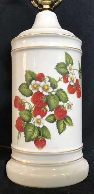 Vintage Strawberry Floral Ceramic Table Lamp: Ceramic table lamp with strawberry & floral motif against white background. Lamp body measures approx 12 inches in height, not including harp. Harp and finial measure approx 12.25 inches in height. la