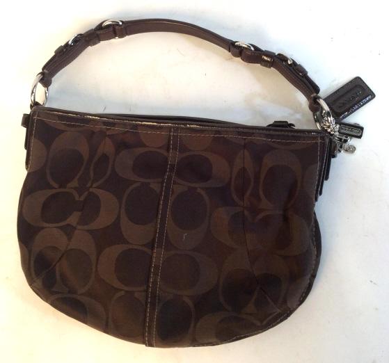 BROWN LABLED FOR COACH SHOULDER BAG: Coach brown shoulder bag measuring approximately 13 by 10 inches. Coach keychain accessories attached to loop on side of bag. Inner lining is brown and had brown stitching. Authenticity label located