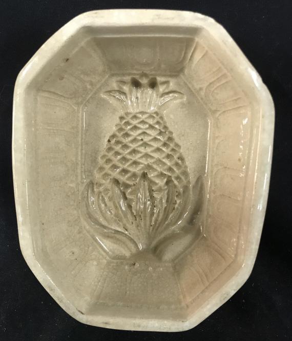 Antique Jelly Mold With Pineapple Pattern: Antique Jelly Mold With Pineapple Pattern, beige toned, crazing throughout, chip top and lower edge, measures approximately 6.5 inches in length x 5.25 inches wide x 3 inches deep. Antique Bakeware, J
