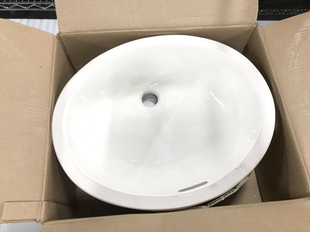 TOTO Under Counter Lavatory Sink: TOTO Under Counter Lavatory Sink, color Sedona Beige, oval in shape, sink measures approximately 18 inches long x 16 inches wide x 8 inches deep, no condition issues noted. Comes in original box. Bath
