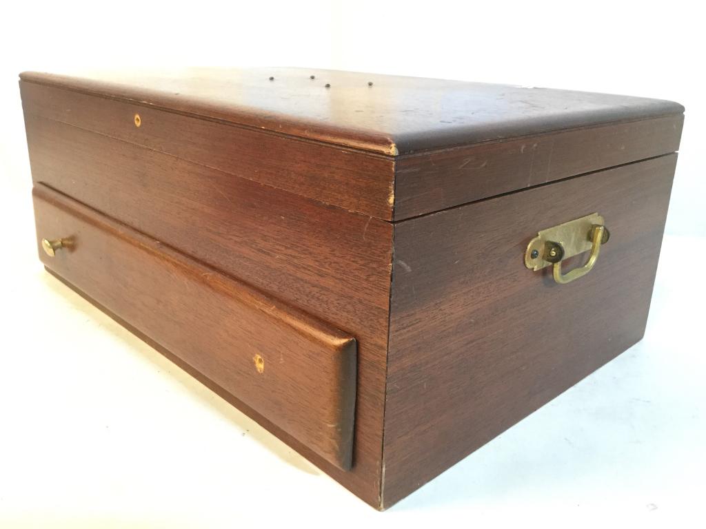 Carved Wooden Silverware Box: Box is wooden. Includes 2 gold toned handles, interior has Silverware holders as well as drawer. Piece measures approx 18 inches long 12 inches deep 7 inches deep. Piece is missing some knobs, contain
