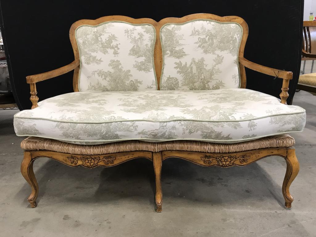 Country French Provential Style Rushed Seat Settee: Country French Provential Style Rushed Seat Settee with sea foam green on cream toile fabric and green welted trim. Carved wooden pine toned frame with rushed seat. Some minor chips and surface scratc