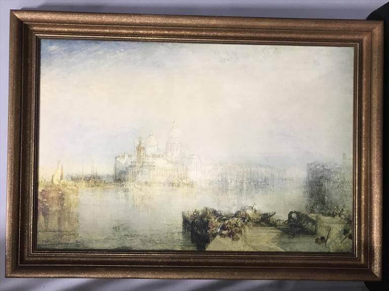 Framed J.M.W. TURNER Print on Board: Framed J.M.W. TURNER, William Turner print of cityscape on board. Board is set in broze tone wood frame. Measures approx 29.5 inches in height by 41.5 inches in width with frame. Decorative wall art, 