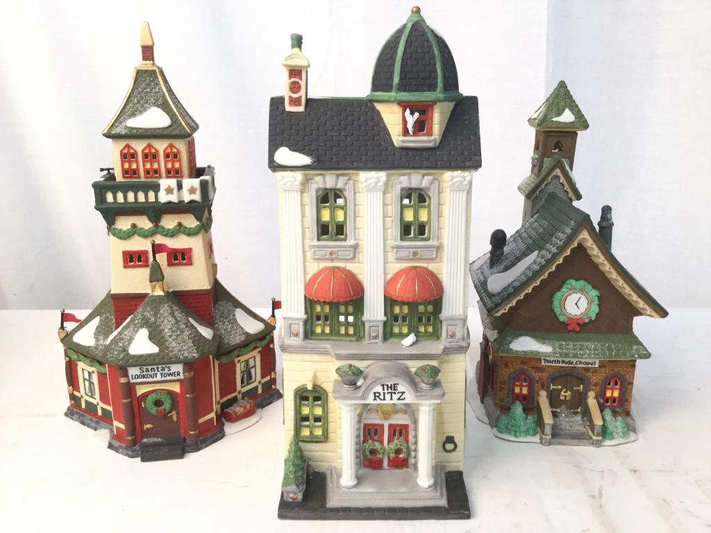 Lot 3 NORTH POLE SERIES House Lamps: Undersides reads NORTH POLE SERIES. Lot includes 3 lamps. THE RITZ, SANTAS LOOKOUT TOWER, & NORTHPOLE CHAPEL. Largest piece measures approx 11.5 inches tall 5.5 inches deep 4.5 inches wide. Have not b