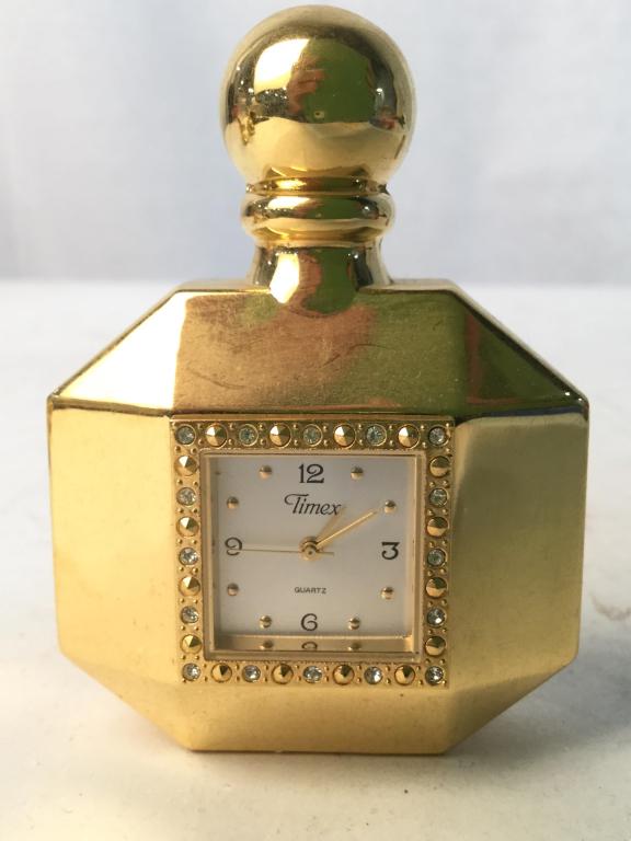 Group Lot 6 Miniature Desk Clocks: Desk clocks are gold toned & silver toned. Lot includes various shaped Of clock. Largest one measures approx 2.5 inches tall and wide. decorative accessories, home decor, shelf pieces 6