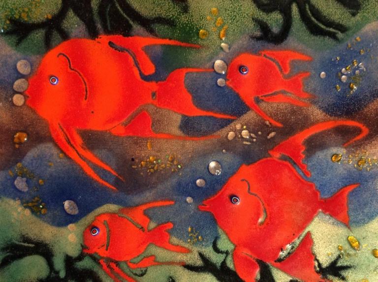 Enamel on Metal Fish Artwork: Metal plaque with brightly tone details enamel design, four bright red fish swimming in purple and green toned Background, dimensional details. Measures approx 8 in by 7 in. Wall plaque, artwork, mixe
