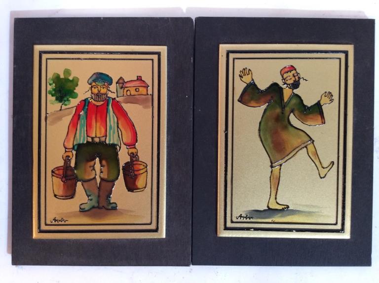 Pair Signed Enamel painted plaque Judaica Art: Painted black toned wooden plaques, artwork appears to be enamel on this wood plaque, gold toned grounds, colorful depictions of farmer and dancing man, signed, appears to read Aviro, measures app 6 i
