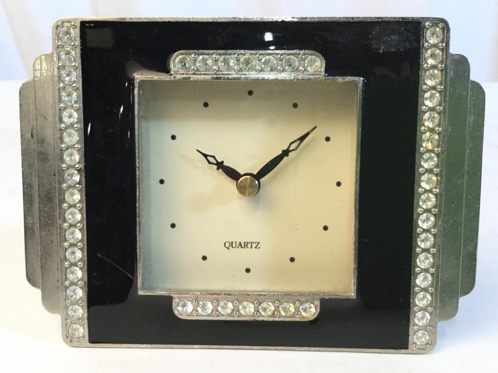 Vintage Desk Clock W Rhinestones: Desktop clock is vintage. Appears to have Rhinestone detail. Piece measures approx 5.5 inches long 4 inches tall. decorative accessory, shelf piece, mantle piece decor, shelf piece 5