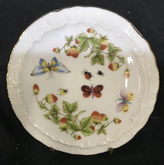 ROYAL CROWN SPRING TIME DECORATIVE PLATES: Decorative plates or possibly trivets. Gold toned accent on outside. Vessels are for decorative purposes. Both pieces appear to have strawberry plants and butterflies. Both pieces Measure approx 6.5 i
