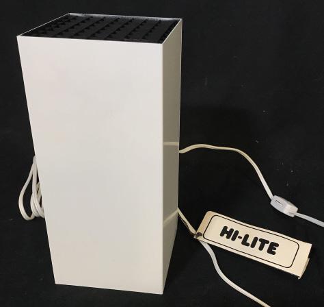 Vintage Hi-Lite Plug In Lamp: Plug in lamp made by Hi-Lite. Bulb not included. Original info tag still attached. Stands approximately 9.5 inches tall. Lightbulb not included. Remove top to screw on lightbulb. Wipe clean. Vintage l