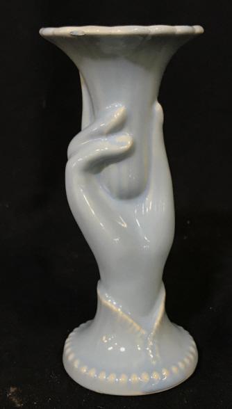 Vintage blue Hand form vase/candle holder: Vintage vase or candle holder. Made in USA. Vase is depicting a hand holding the vase. Light blue glaze on white ceramic / porcelain . Needs cleaning. Stands approximately 7 inches tall. Base is appro