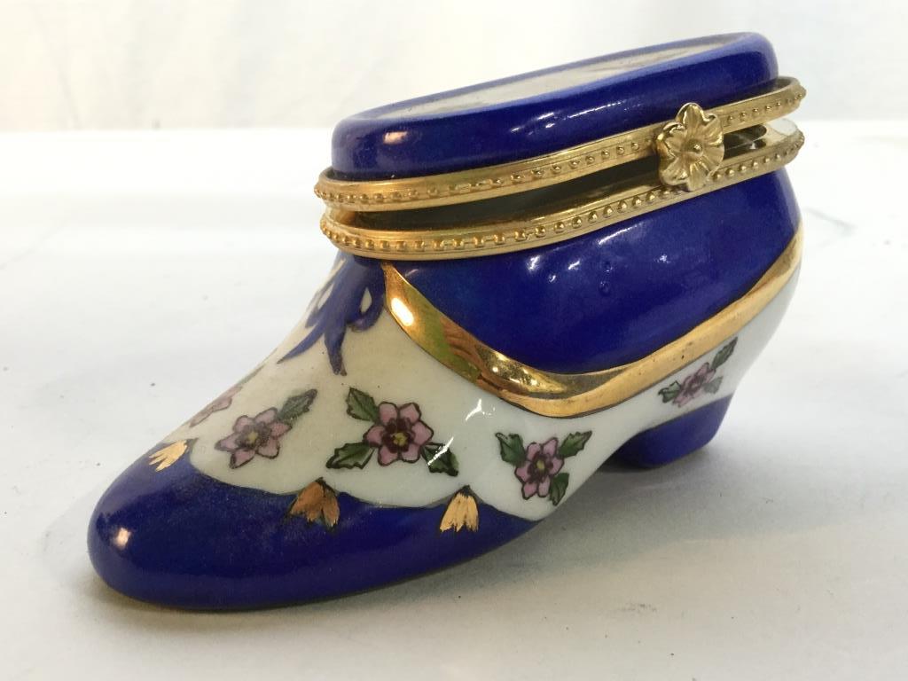 Porcelain Shoe Shaped pill Box: Trinket Box is Porcelain. Appears to be hand painted. With floral & leaf detail. Measures approx 4 inches long 2 inches tall. pill box, decorative accessory, vanity accessory, tableware 6