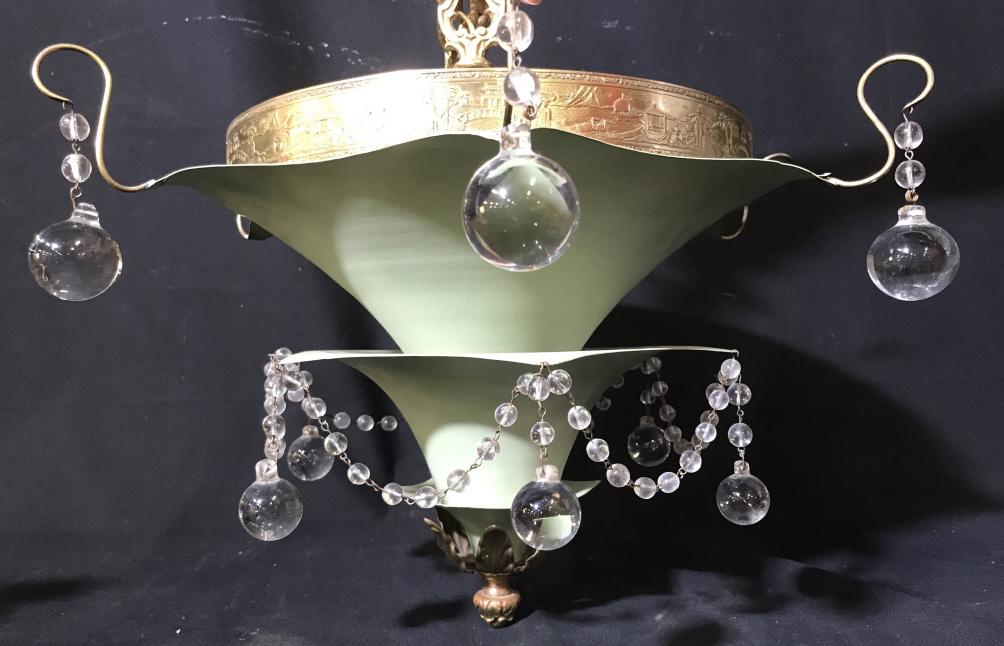 Metal Pendant Light Fixture W Crystal Ball Beads: Metal is pale green in tone with brass tone metal accents. Top of pendant has embossed metal band depicting figures in landscape. Crystal glass ball beads draped around pendant. Some beads might be mi