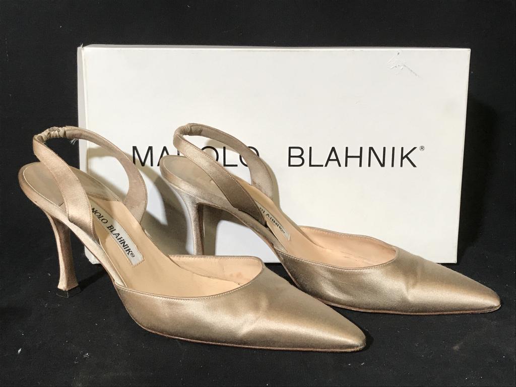 Pair MANOLO BLAHNIK Designer Slingback Pumps: With Shoe Box and dust bag. Pair of MANOLO BLAHNIK luxury designer slingback heels, pumps in champagne gold tone satin with leather sole and lining. ‘Carolyne’ shoe. Marked for Manolo BLAHNIK, Siz