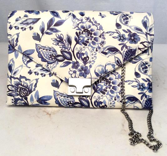 LOEFFLER RANDALL Floral Chain Purse: white and blue floral ink design/leather with a silver push lock, thin chain strap and 2 large interior pockets with smaller pockets inside of them. Interior design on purse matches the design on the 