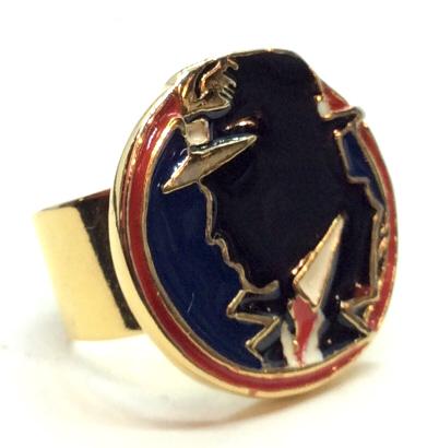 WENDY GELL Disney Cocktail Ring W Enamel Design: Marked on side of band for WENDY GELL DISNEY CO. Gold toned metal adjustable band cocktail ring, circular face measuring approx 1 in in diameter, design of retro 60s era spy/detective, women’s vinta