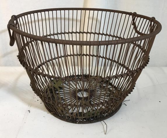 Antique metal woven basket: Antique metal wove basket measuring approximately 12 inches tall. Antique wear evident. Wire basket with handles. Handles do not move. Rustic. Primitive metal, storage , organization, planter, metal p