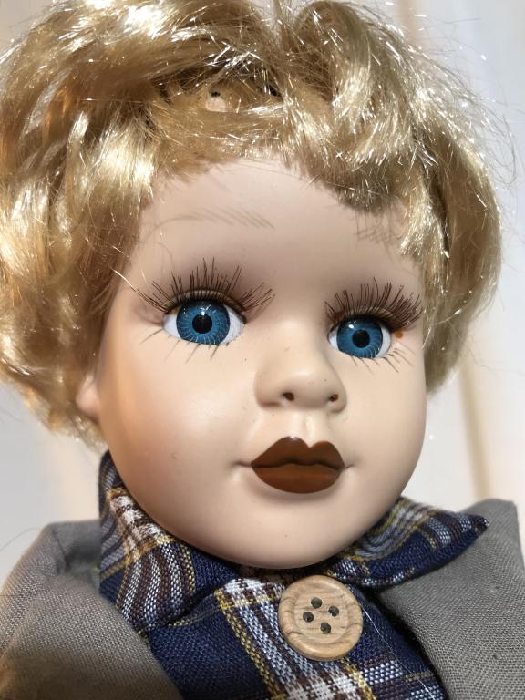 Vintage Collectible Porcelain Doll with Stand: Vintage possibly antique. hand-stitched body and clothes. Painted porcelain face with glass eyes. Leather shoes. Comes with stand. No additional markings found. Vintage doll, collectible doll, vintage