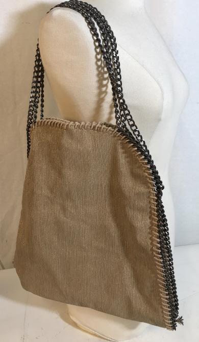 Sparkle fabric tote with chain shoulder strap: Possibly vintage. No brand evident. Bag includes two different length chains. Magnetic closure. Three inner pockets. Inside is lined with a light brown material. Measures approximately 15 inches wide 