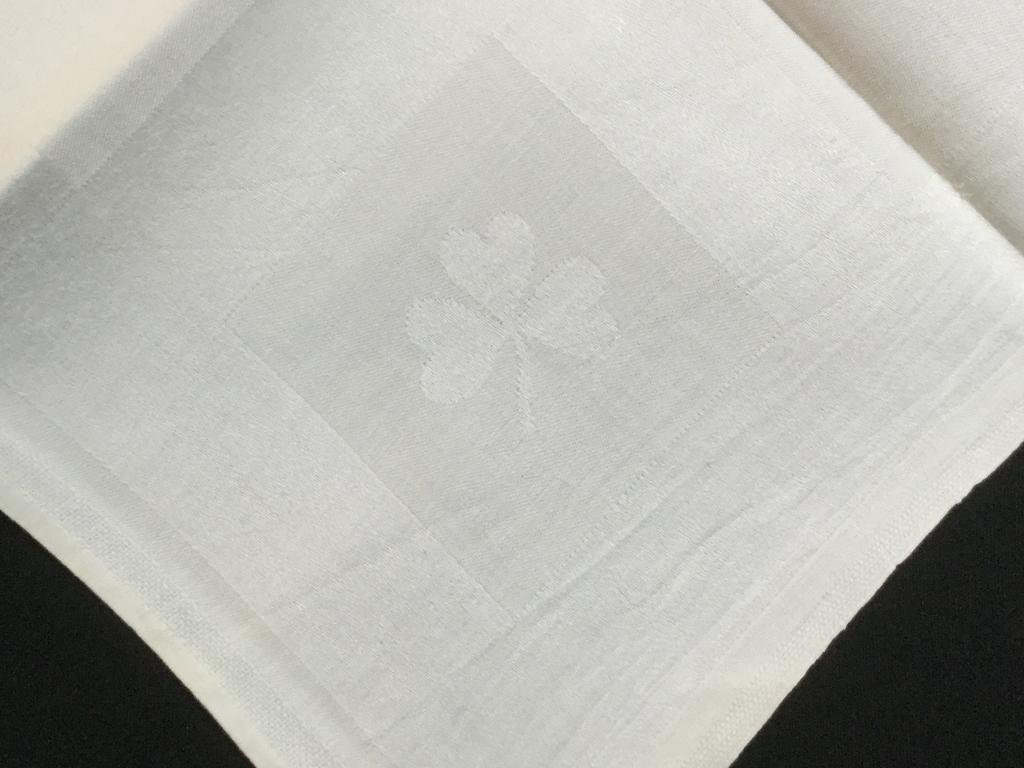 Set 10 Vintage Shamrock Table Linens: White on white with tonal fabric shapes. Shamrock pattern throughout. Approx 27 x 26 1/4 in. Soft cotton & linen. A couple pieces with blemishes but no tears or major discoloration. Vintage Table Line