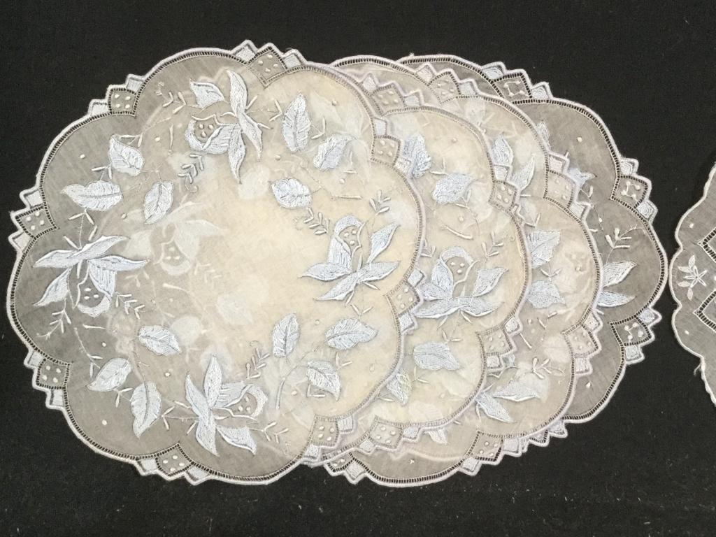 Set 23 Collectible Sheer Embroidered Vntg Doilies: 34 in total, 2 different designs, same fabric, slightly different hues of blue. 11 round doilies, approx 6 1/4 in. diameter . Embroidered Leaf pattern. Victorian Style. No rips, marks. Crisp baby blue