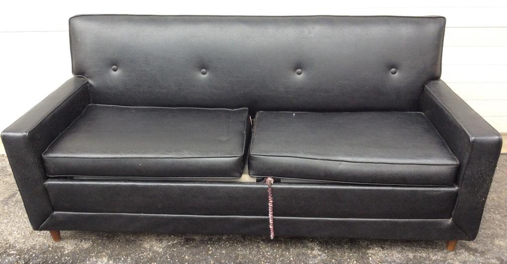 KROEHLER SLEEPER LOUNGE: Leather style upholstered pull out sofa, some wear to upholstery as photographed. Not fully opened and inspected. Measures approx. 31 in by 32 in by 70 in. Home furnishings and accessories, upholstere