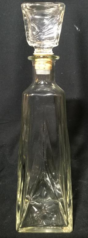 Glass Decanter W Stopper: Decanter is glass. Includes stopper. Decanters Shape tapers in slightly towards mouth. Measures approx 12 inches tall 3.5 inches square. decanter, barware, shelf piece, drinks vessel, drinks service 6