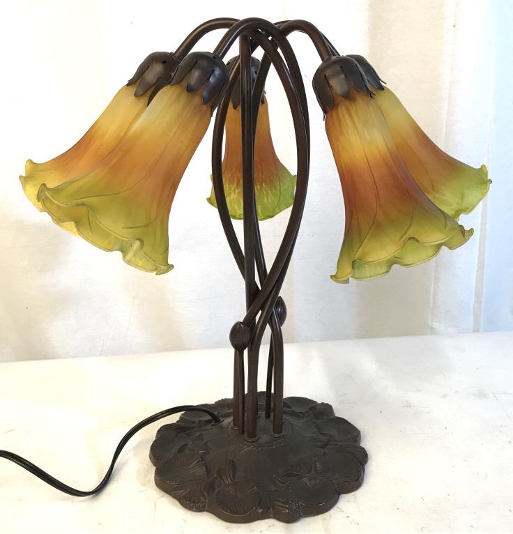 TIFFANY Style Art Nouveau ‘Pond Lily’ Table Lamp: 5-light TIFFANY Style Table Lamp stylized as lilies emerging from pond lily base. Brown tone metal base with two-tone orange and yellow stained glass lamp shades. Lamp has not been tested. Measures ap