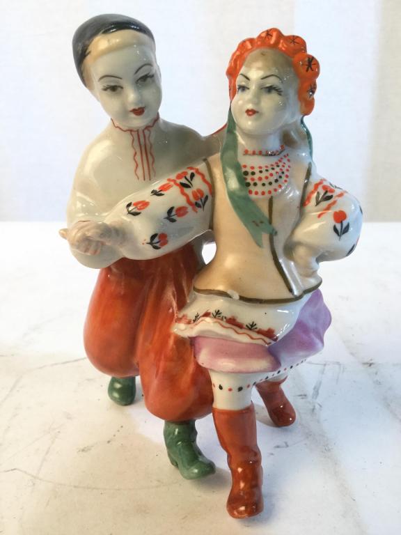 Ukrainian Porcelain Figural: Piece is porcelain. Depicts 2 figures dancing. Piece measures approx 5 inches tall 3.5 inches wide. Piece has illegible marking on underside. Piece has some minor chips. collectible porcelain sculptur
