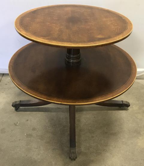 Antique Two Tiered Dumbwaiter Pedestal Table: Antique Two Tiered Wooden Dumbwaiter Pedestal Table, Possibly English, with inlaid banded boarders, turned center column, four legged reeded base with metal claw feet over casters, measures approximat
