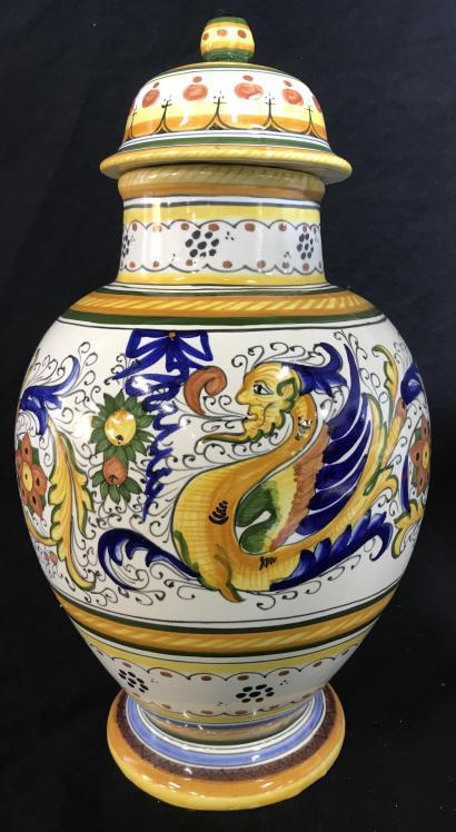 Italian Deruta Style Majolica Pottery Urn Jar: Italian ceramic, Hand-Painted majolica Lidded ginger jar. Italian studio art pottery jar is has floral and chimerical motifs in tones of yellow, blue, green and rust red against white ground. Jar is m
