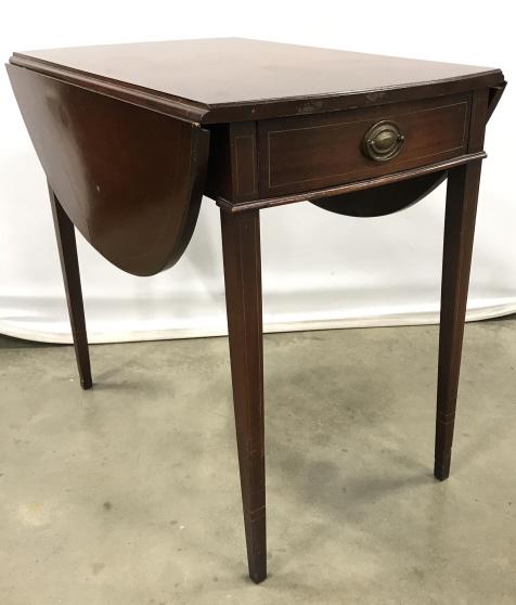 Vintage Drop Leaf Pembroke Table: Vintage American Drop Leaf Pembroke Table with center drawer, two drop leaf sides and tapered legs, some surface scratches and nicks to legs, measures approximately 40 inches wide with leaves up, 18.5