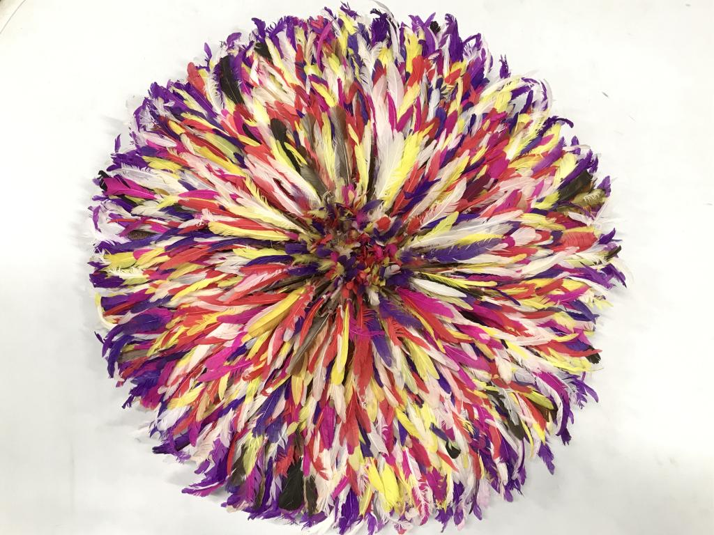 African Art Ceremonial Bamileke Feather Hat: Feathered Ceremonial Bamileke dancing hat from Cameroon, also used as a decorative wall hanging accessory. Feathers in rich shades of magenta, purple, orange, and white tones. Woven grass base for str