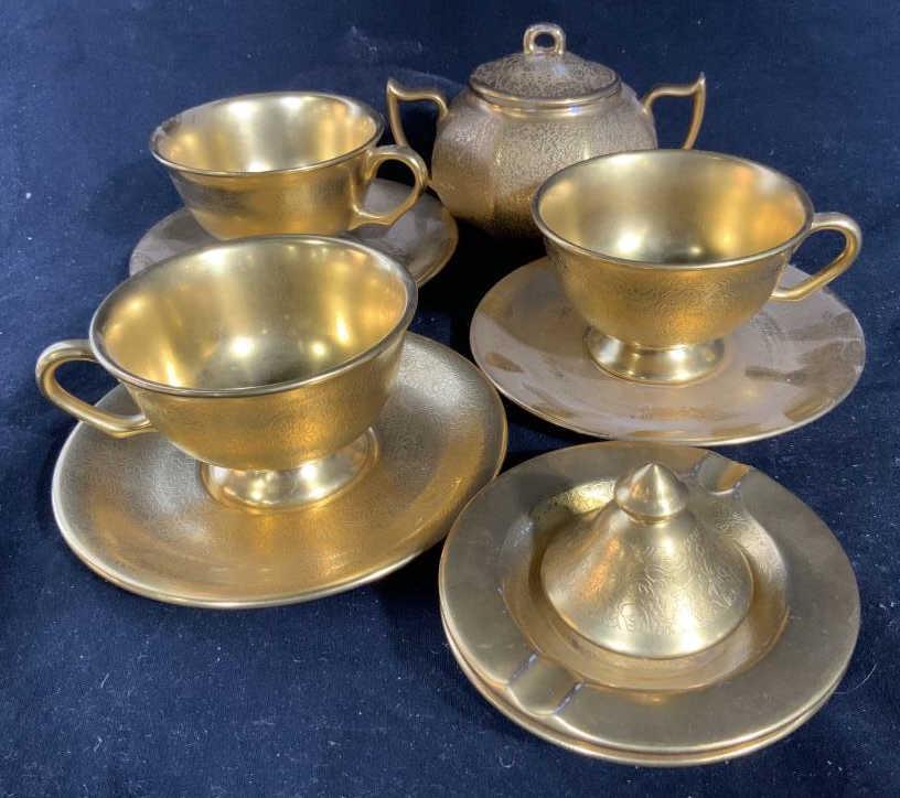 Group PICKARD 22K Gold Porcelain Tableware: All marked for Puckard, Made in USA, circa 1920 vintage antique porcelain, Lot includes three cups and saucers, sugar dispenser, lid, two ash trays, collectible porcelain, Puckard tableware, diameter 