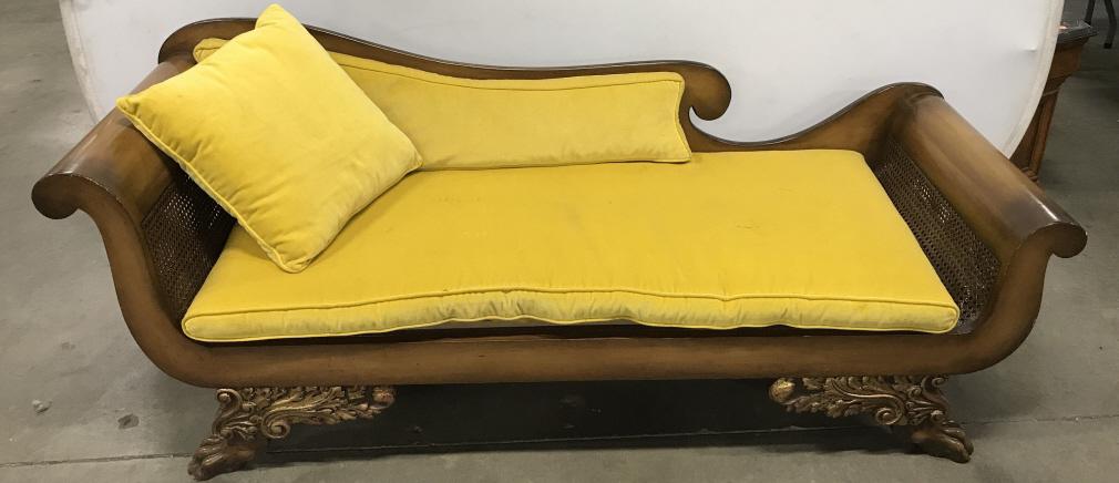 Vintage Claw Footed Chaise Lounge: Vintage Chaise Lounge with caned seat and sides, carved claw footed feet with gilt scroll and leaf design, and mustard toned velvet cushions, damage to seat under cushion, small nicks to edges and mar
